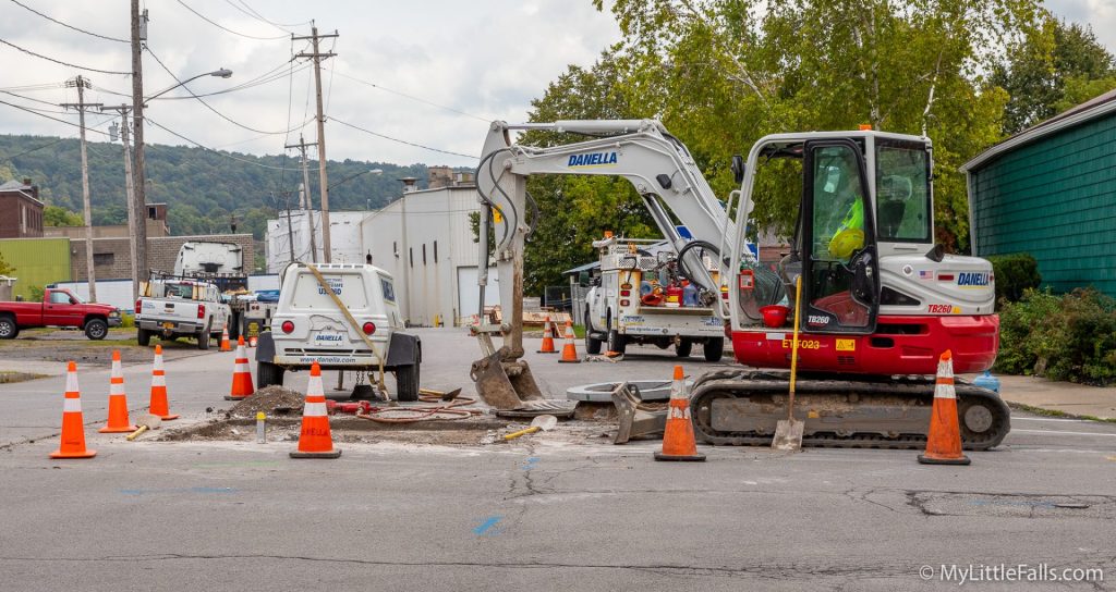Photo by Dave Warner - Road work continues at the corner of Ann St and Mill St in Little Falls.