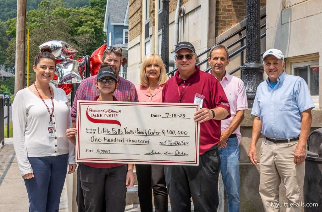 Photo by Dave Warner - L-R Jennifer Frame, Corporate Donations Department, Teresa Cotton (front) Scott Baumes Corporate Coordinator, Deborah Kaufman, Chairman Youth and Family Center Capital Campaign, Dave Shepardson, Manager of the Stewarts in Little Falls, Frank Mendl, Chairman of the Board, Youth and Family Center, and Tony DeLuca, Executive Director, Youth and Family Center.