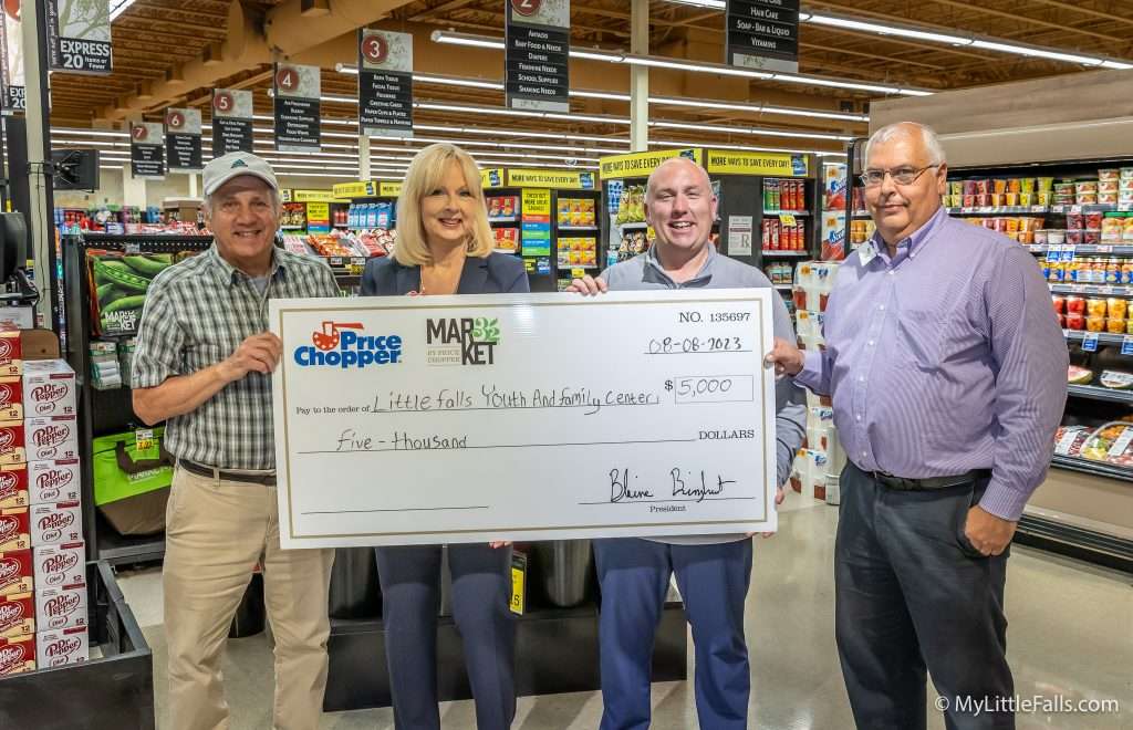 Photo by Dave Warner - Tony DeLuca, Executive Director of the Little Falls Youth and Family Center, Deborah Kaufman, Campaign Chairwoman, Bob Kennedy, Zone Director, and Michael Netoli, Store Manager pose with the donation check.