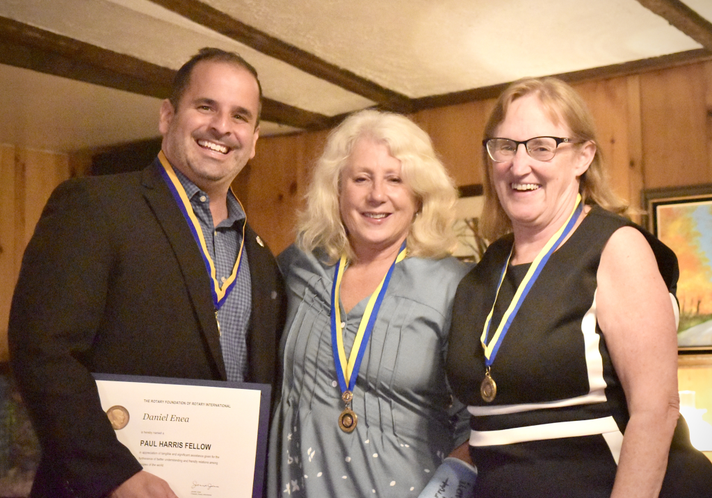 L-R Daniel J. Enea receiving his Paul Harris award, pictured with Patricia Talaba, Membership Chair, and Christine VanMeter, MBA, Ea, all wearing their Paul Harris Medals.