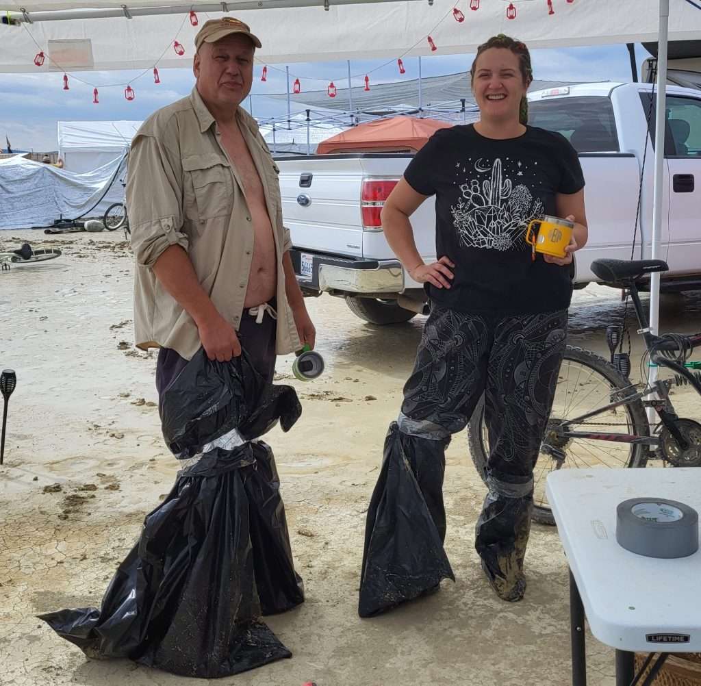 Deena and Larry wearing plastic bags
