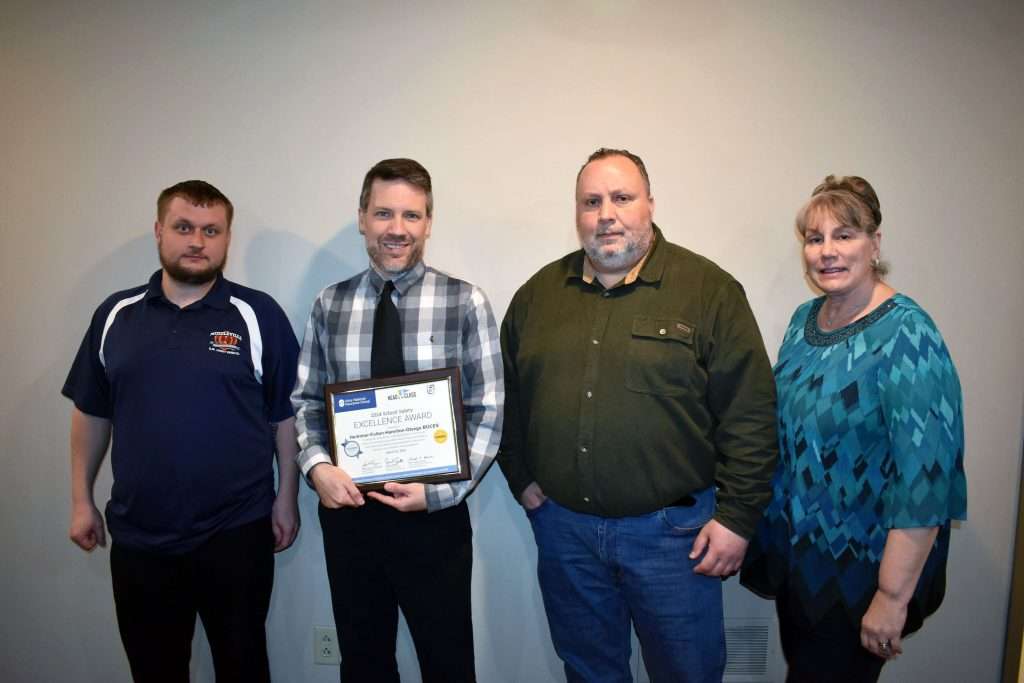 Herkimer-Fulton-Hamilton-Otsego BOCES recently won Utica National Insurance Group’s School Safety Excellence Award for 2024 at the Titanium with Honors level. Pictured, the Herkimer BOCES Safety Services team poses with the award. From left: School Facilities Advisor Donald Maxwell, Supervisor of Safety Services Adam Hutchinson, School Safety Advisor James Garcia and PBIS Coordinator Kellie Maxwell.