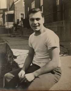 18 year-old Joe Vespasiano near grandparent's house on 1 Casler Street. Jimmy DeRosa in background