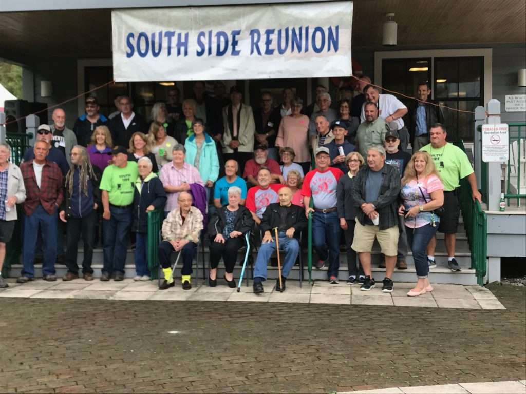 Group photo of the 2019 South Side Reunion featuring Father Dan Lanza, Harriet Green, and Joe Vespasiano front and center