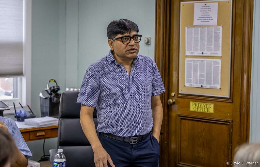 Photo by Dave Warner - Sonny Patel (standing) gives a presentation and answers questions about a proposed Canna Planet business in Little Falls.